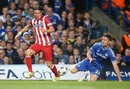 Filipe Luis wins the ball from Gary Cahill