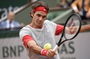 Roger Federer returns a backhand slice