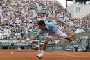 Novak Djokovic chases down a shot