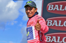 Nairo Quintana celebrates on the podium with the pink jersey