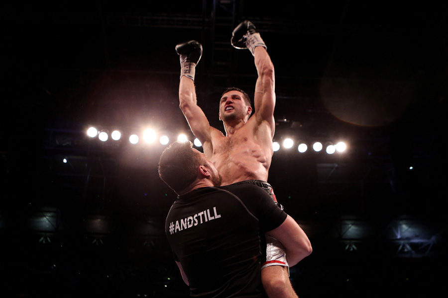 Carl Froch is lifted into the air after stopping George Groves