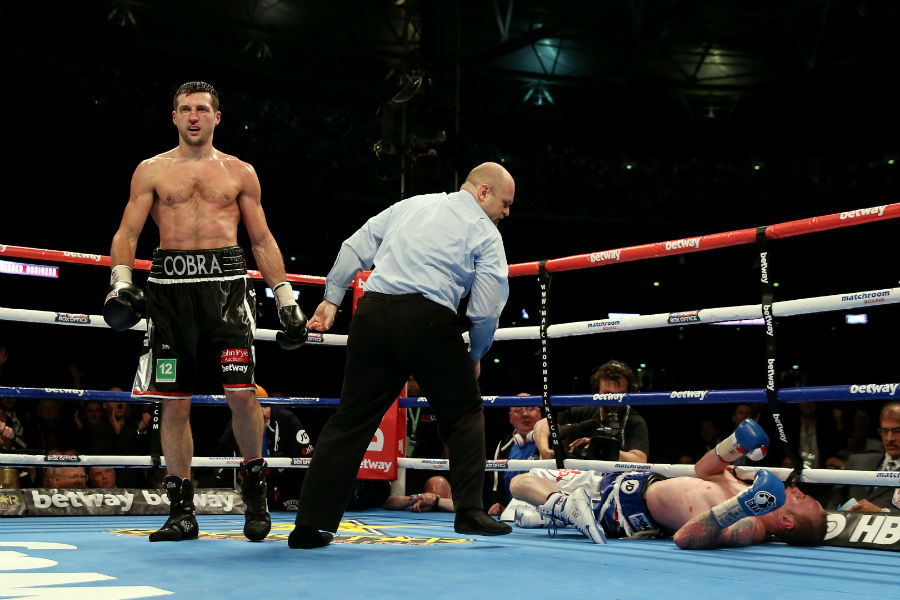 Carl Froch looks on as George Groves lies on the floor