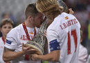 Sevilla's Alberto Moreno and Ivan Rakitic celebrate with the trophy after winning the Europa League final