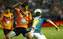 Pachuca's Jurgen Damm challenges Leon's Mauro Boselli for the ball