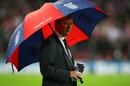 Steve McClaren strikes the pose which will see him dubbed the 'Wally with the Brolly'