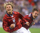 David Beckham celebrates scoring a free-kick against Columbia
