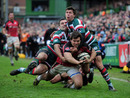 Schalk Brits is tackled as he charges for the line