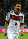 Mesut Ozil celebrates scoring for Germany in extra time