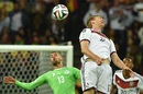 Algeria's forward Islam Slimani and Germany's defender Per Mertesacker vie for the ball