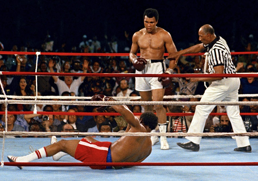 Muhammad Ali looks on after knocking down defending heavyweight champion George Foreman