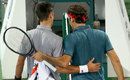 Novak Djokovic and Roger Federer meet each other at the end of their match