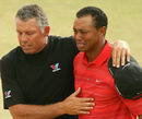 Tiger Woods is comforted by caddie Steve Williams