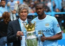 Manuel Pellegrini and Yaya Toure pose with the trophy