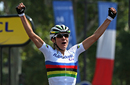 Marianne Vos celebrates as she crosses the line to claim victory in La Course