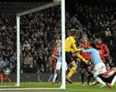 Carlos Tevez pounces to head home for his second of the night