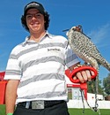 Rory McIlroy poses with a falcon on his arm