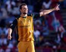 Dirk Nannes celebrates the early wicket of Chris Gayle