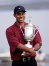 Tiger Woods hugs his US Open trophy