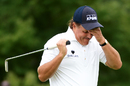 Phil Mickelson reacts after missing a putt for birdie on the 10th green