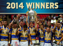 Leeds players celebrate with the trophy after winning the Challenge Cup final