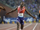 Justin Gatlin roars as he crosses the line first