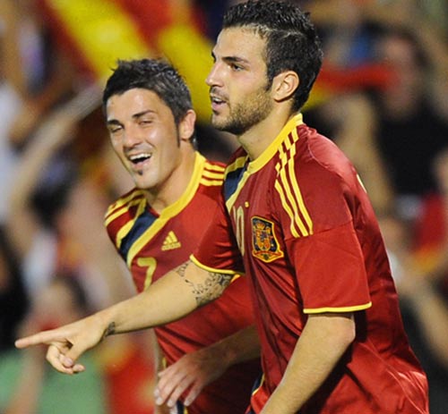 Cesc Fabregas celebrates with David Villa