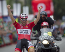 Lotto-Belisol's Adam Hansen celebrates as he crosses the finish line to win the 19th stage of the Vuelta a Espana