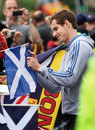 Andy Murray signs a Scotland flag