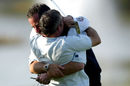 Sam Torrance and Paul McGinley embrace after the winning putt