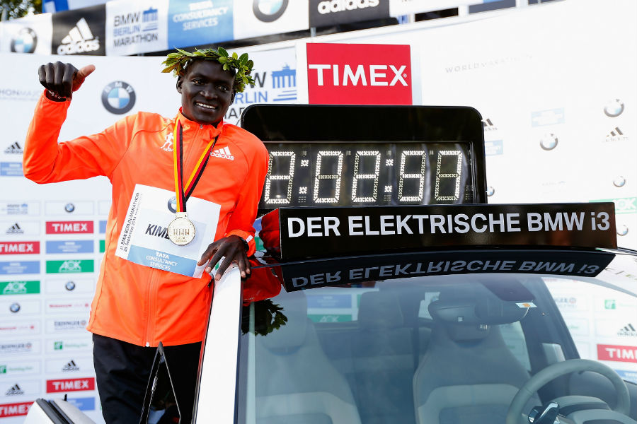 Dennis Kimetto of Kenya poses with his new world record time