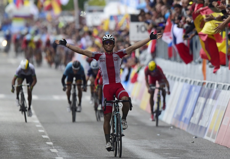 Poland's Michal Kwiatkowski celebrates as he crosses the finish line