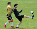 David Villa (L) and Cesc Fabregas take part in a training session