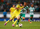 Chelsea's Diego Costa is chased by Sporting Lisbon's Mauricio in the Champions League