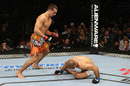 Rory MacDonald attacks Tarec Saffiedine in their welterweight bout