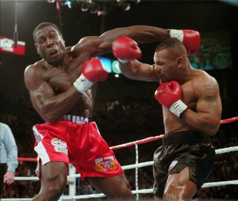 Frank Bruno trades punches with Mike Tyson