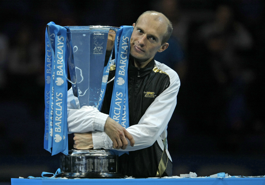 Nikolay Davydenko poses with the Barclays ATP World Tour Finals trophy