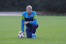 Arsene Wenger watches his players in training