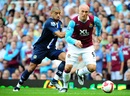 Blackburn Rovers' Steven Reid and West Ham United's Dean Ashton battle for the ball