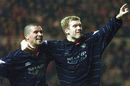Roy Keane celebrates with Paul Scholes