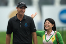 Nicolas Colsaerts jokes with a fan after the ninth hole of his second round