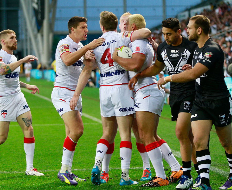 Ryan Hall celebrates a try with his team-mates