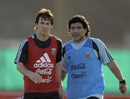 Argentina's football team coach Diego Maradona takes the job of marking Lionel Messi during a training session