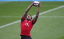 Courtney Lawes leaps to catch a ball