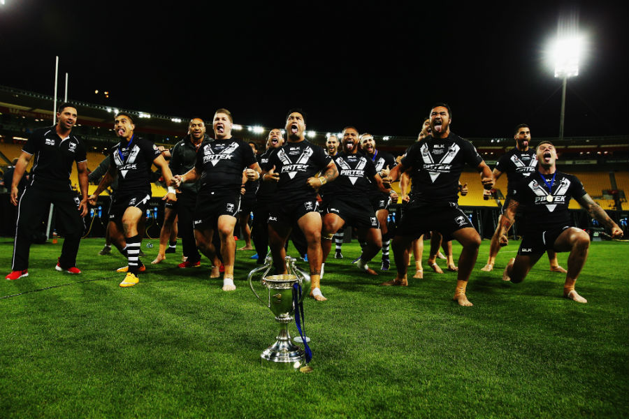 New Zealand players perform the haka after lifting the Four Nations title