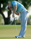 Rory McIlroy reacts to a missed putt on the green