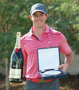 Rory McIlroy shows off his European Tour Golfer of the Month award ahead of the third round of the Tour Championship