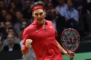 Roger Federer reacts after gaining a point 
