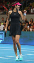 Ana Ivanovic celebrates a point against Daniella Hantuchova in the IPTL