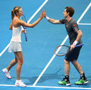 Andy Murray and Maria Sharapova high five during an IPTL doubles match against Kristina Mladenovic and Nenad Zimonjic