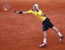 Lleyton Hewitt stretches to reach a forehand